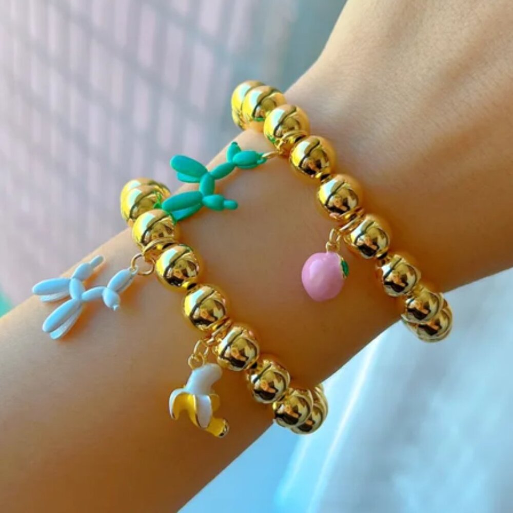 18K gold-plated copper bracelets with banana and  dog charms.